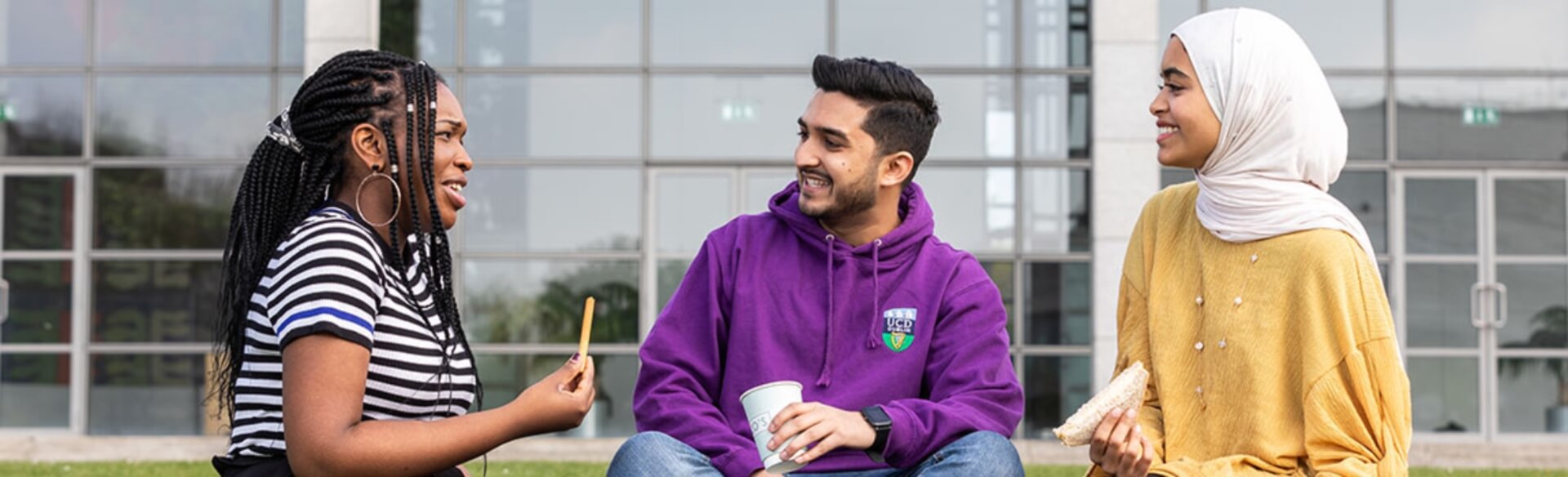 three international students eating lunch on UCD campus